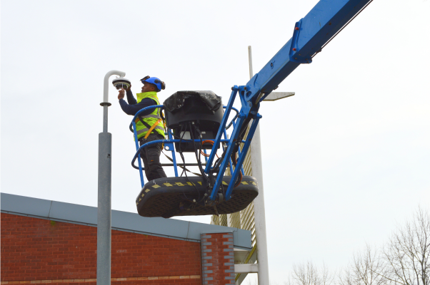 A Link CCTV Engineers working on a cherry picker at Templars Shopping Park
